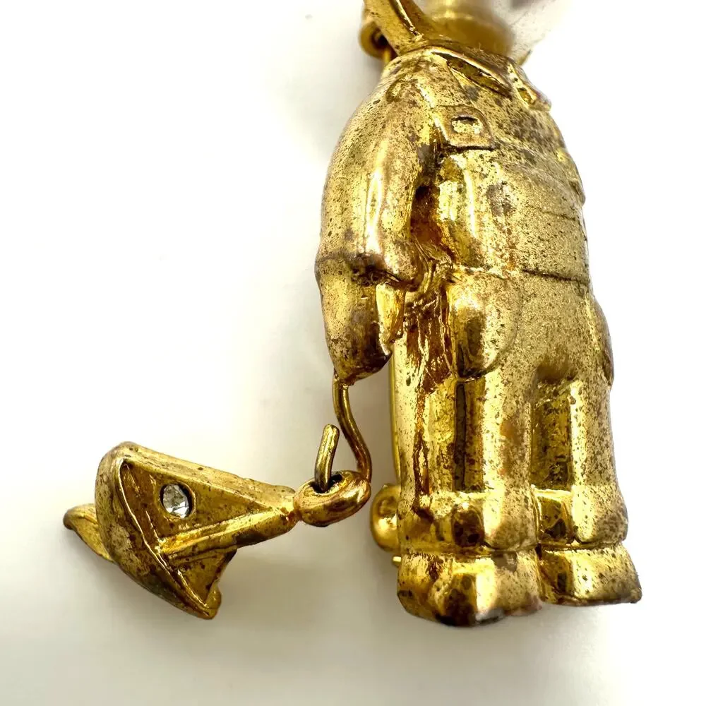 Vintage gold tone boy child with sailboat faux pearl articulated figural brooch